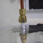 Copper coupling joining the top of the pressure cooker to the copper tubing